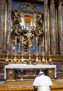 File photo of Pope Francis praying in front of Marian icon in Basilica of St. Mary Major in Rome